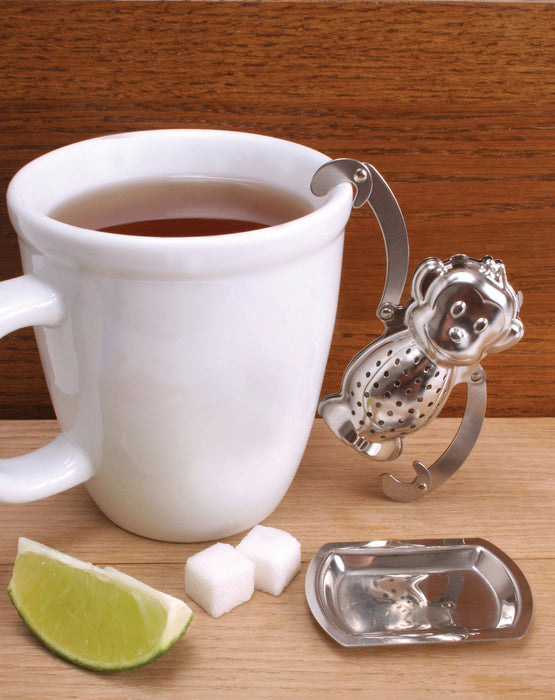 Tee-Aufgusskorb teegeschirr in Affenform hängend an einer weissen Teetasse - Monkey Tea Infuser Teaware hanging from white teacup