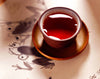 Bio Flussig rote Rooibos Tee in rote Teetasse - Organic liquid red Rooibos tea in red teacup